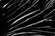 © Kwangmoozaa - transparent plastic film wrap overlay texture on black background