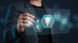 © Infinite Pixel - Business person using a stylus to interact with an educational digital interface on a screen with out focus background light bokeh effects professional development concepts against dark