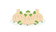 © Shuvo - Traditional Georgian khinkali dumplings served on a plate with fresh green coriander leaves garnish.