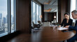 © Natalia - Business executives reviewing and signing contracts in modern boardroom