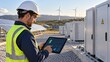 © ชลธิชา สว่างวงค์ - Engineer monitoring renewable energy solar panel and wind farm system efficiency via digital tablet device data interface