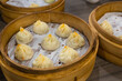 © leungchopan - Multiple bamboo steamers with soup dumplings in taiwan