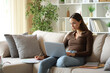 © Antonioguillem - Telecommuter working online at home and filling out form