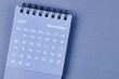 © gamjai - November 2027 Monthly desk calendar for 2026 year on blue background.