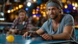 © COK House - A bearded man with a headband leans on a ping pong table holding a paddle while a blurred opponent sits in the background.