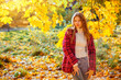 © Vantsura - Young person poses outdoors in autumn with trees in the background during golden hour light