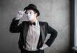 © Nomad_Soul - Rear view of a mime artist with hands clasped behind his back