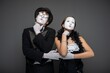 © Nomad_Soul - Thoughtful mime couple posing with hands on chins