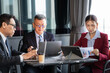 © winnievinzence - A business team collaborates during a strategy meeting in a corporate office, sharing ideas and analyzing financial charts together to achieve common goals and foster professional growth.