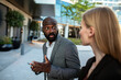 © Davor - Businessman with smartphone reacting to colleague outdoors