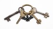 © creativestock - Collection of antique skeleton keys with a bat charm on a white background