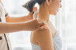 © Wanda - Asian woman is being massaged shoulder by compress in room