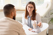 © Pixel-Shot - Chiropractic consultation and spinal health, doctor explaining spine anatomy to patient in medical clinic for back pain treatment and physical therapy