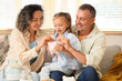 © Pixel-Shot - Financial literacy and family savings, parents teaching daughter to save money in a piggy bank at home for future education and household budget goals
