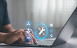 © MUNTHITA - Person using laptop for technical support with customer assistance, IT service and problem solving. Professional help desk, system maintenance and reliable technology support for business operations.