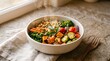 © Tanisha - Steaming healthy Buddha bowl with roasted sweet potato chickpeas kale and seeds on stone table