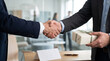 © Dmitry - Handshake between boss and employee with gift on Boss's Day