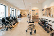 © Kassiopeia  - The store features a variety of mobility aids including wheelchairs and walkers. Customers explore the options in an open and well-lit space