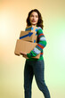 © LIGHTFIELD STUDIOS - Young woman joyfully embracing a shopping haul on Black Friday with stylish grace