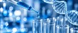 © Chandan Tripathy - Scientist using pipette to drop liquid into test tubes for dna