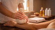 © Ksenia - Herbal compress massage on arm, traditional bodywork, pain relief and holistic spa therapy
