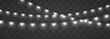 © ikril - Christmas string lights PNG. Silver realistic garland with luminous white bulbs and glowing LED lamps. Xmas decoration isolated on transparent background. Vector illustration.