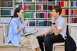 © Valerii Honcharuk - Middle-aged female counselor talking to a teenage boy in the library