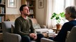 © Bruno Stock - Man crying during therapy session with therapist listening attentively in a cozy living room setting
