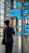 © CaptureCollabStudios - Thoughtful businesswoman looking at blank glowing directional signpost arrows choosing career path and decision making concept