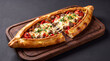 © Food Shop - Freshly baked turkish pide with meat and melted cheese served on a