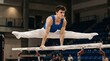 © Oleg - Young male gymnast balancing on parallel bars with legs extended in a split inside an indoor sports arena. Athlete training gymnastics strength and flexibility during a competitive apparatus routine.