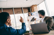 © deagreez - Professionals engaged in a collaborative meeting in a modern office environment discussing strategy and teamwork