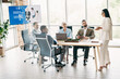 © deagreez - Group of diverse professionals collaborating in modern office setting during a business meeting presentation