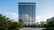 © NiftyMoods - Modern glass office building with contemporary architectural design in a corporate business district under a clear blue sky
