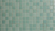 © Designbd25 - Seamless pattern of small square teal and light green bathroom tiles