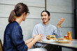 © Studio Beams/Stocksy - Conversation Between Two People in a Modern Cafe Setting