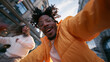 © BlackBridge Media - Happy Young Man Taking Dynamic Selfie With Friend in City