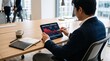 © Yuchen - Financial investor analyzing tablet displaying stock market decline and portfolio value drop, checking red downward trend graph