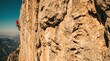 © AspctStyle - Rock climber scaling a vertical limestone cliff wall capturing extreme sport adventure and determination, a visual metaphor for business challenge and goal achievement in nature.