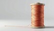 © Chandlerlikes - Roll of sewing thread with smooth textile fibers