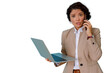© Komora - Businesswoman multitasking, talking on a smartphone and holding a laptop, expressing shock or surprise. Transparent background