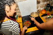 © Alvaro Lavin/Stocksy - Couple cooking pasta and vegetables together in kitchen
