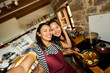 © Alvaro Lavin/Stocksy - Happy diverse friends taking selfie while cooking