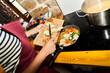 © Alvaro Lavin/Stocksy - Woman cooking fresh vegetables for healthy meal