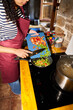 © Alvaro Lavin/Stocksy - Woman cooking fresh bell peppers in kitchen