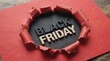 © deloho - Black Friday sale announcement with ripped red paper revealing text