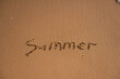 © ZeDesign - A close-up shot captures the word “Summer” written in the wet sand. A gentle wave rolls in and starts to wash away the letters, symbolizing the fleeting nature of the season.