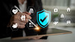 © InfiniteFlow - Business professional using a digital tablet to illustrate concepts of security, health, financial services, technology, and care in a modern workspace environment. Glyphic.