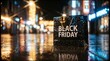 © Sapra - Black Friday sale concept with a single shopping bag on the floor of a store with a blurred bokeh light background representing holiday promotions