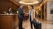 © PRASANNAPIX - Young businesswoman shake hand with hotel manager at hotel